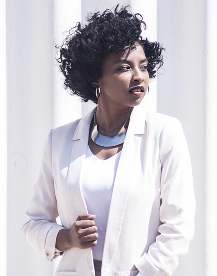 Modeling white tank top and white blazer